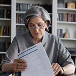 Person reviewing Ticket to Work documents